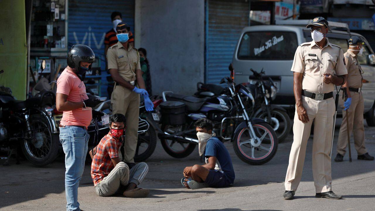 Officers have punished lockdown violators by making them sit in the sun, do squats or by hitting them with sticks. (Reuters)