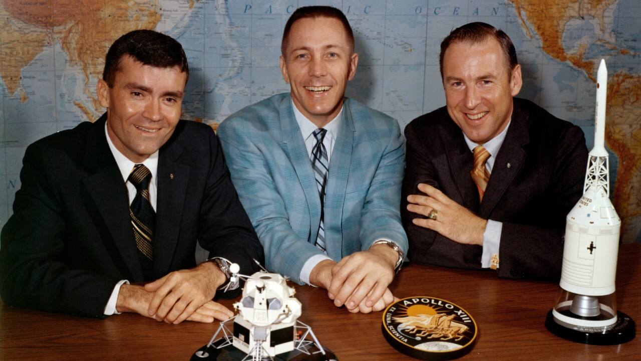In this April 10, 1970 photo made available by NASA, Apollo 13 astronauts, from left, Fred Haise, Jack Swigert and Jim Lovell gather for a photo on the day before launch. (NASA via AP)