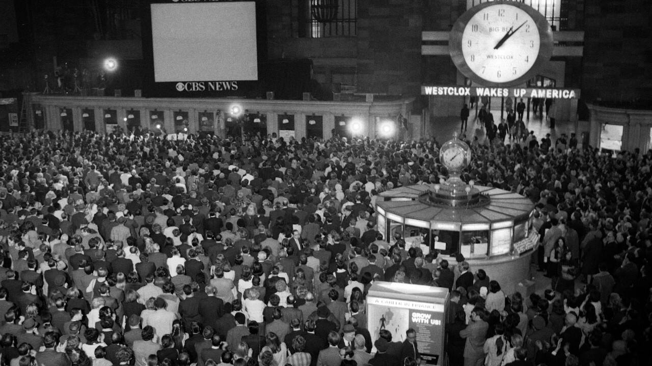 FILE - In this April 17, 1970 file photo, crowds watch a television screen in New York's Grand Central Station waiting for the safe arrival of the Apollo 13 astronauts in the Pacific Ocean. (AP Photo/J. Spencer Jones)