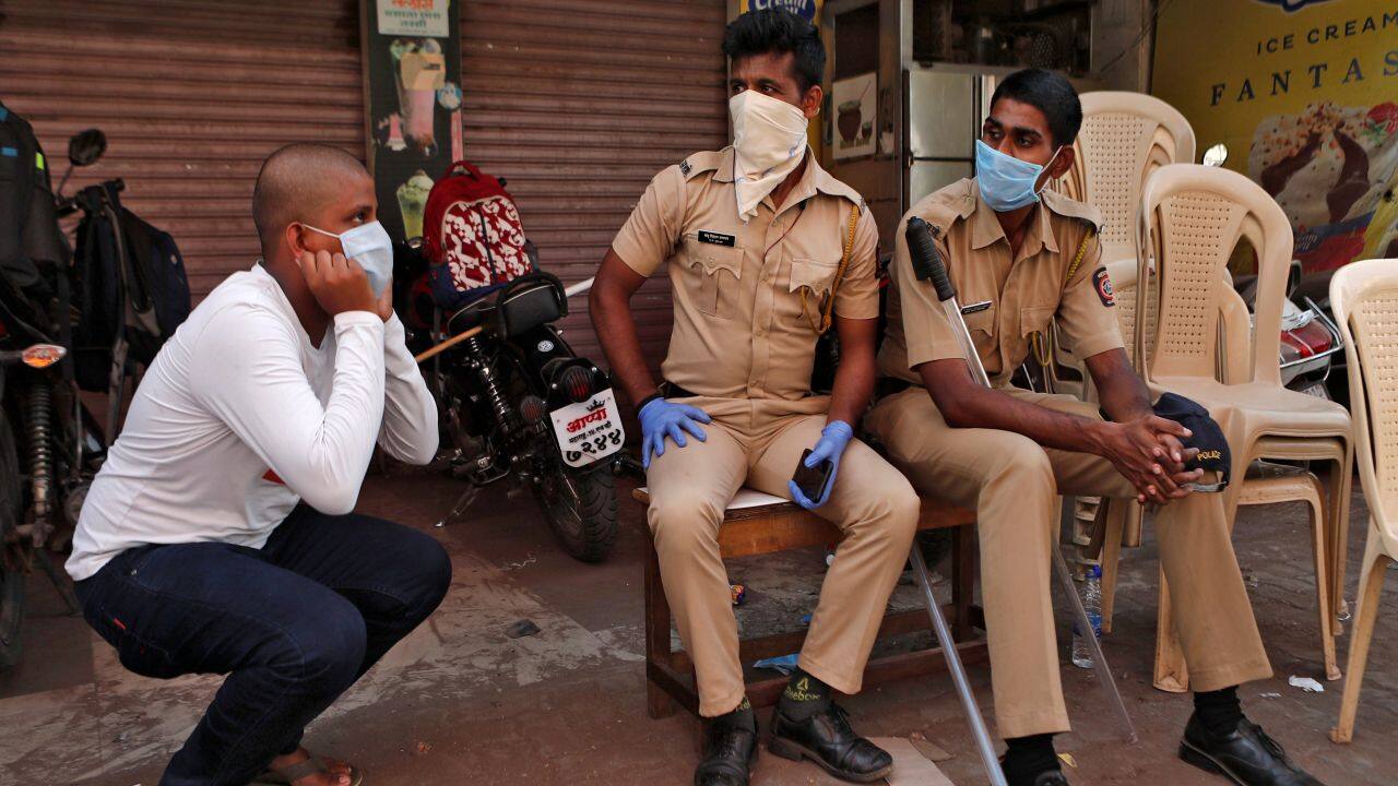 Anxious residents have tied handkerchiefs or shirt sleeves around their faces in lieu of proper masks. (Reuters)