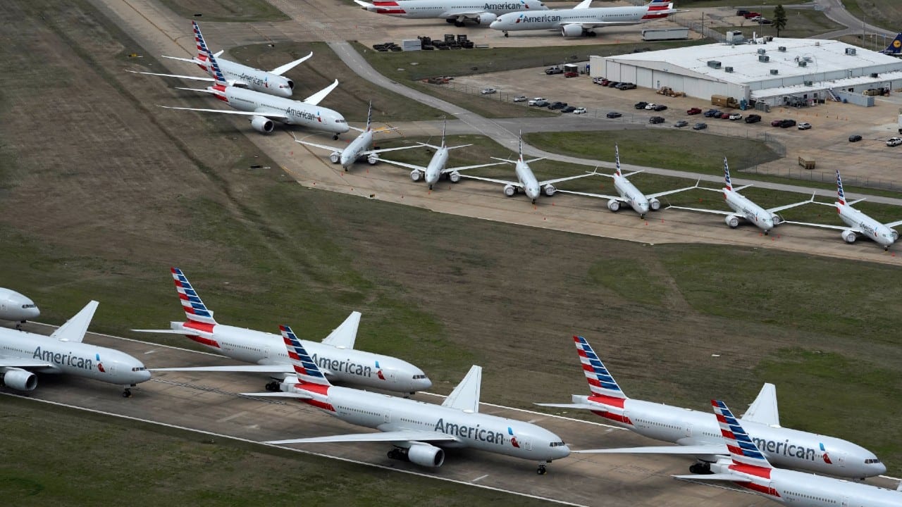 American Airlines passenger planes (bottom) parked due to flight reductions made to slow the spread of coronavirus disease (COVID-19), at Tulsa International Airport in Tulsa, Oklahoma, U.S. The planes at the top are 737 MAX, parked for reasons other than the coronavirus. (Image: Reuters)