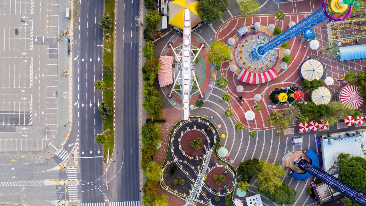 An aerial view shows a closed amusement park and empty road in Tel Aviv, Israel, due to the government's measures to help stop the spread of the coronavirus. (Image: AP)