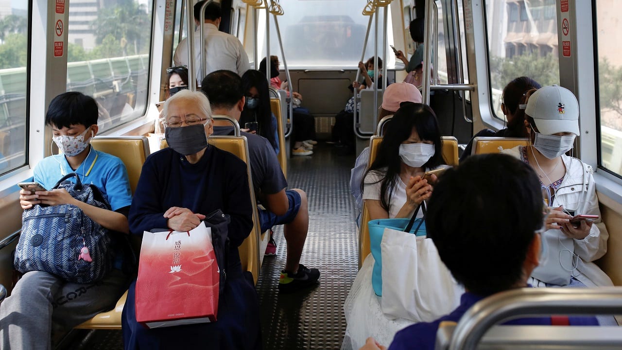 People wear protective face masks inside the metro to protect themselves from the coronavirus disease, in Taipei, Taiwan. (Image: Reuters/Ann Wang)