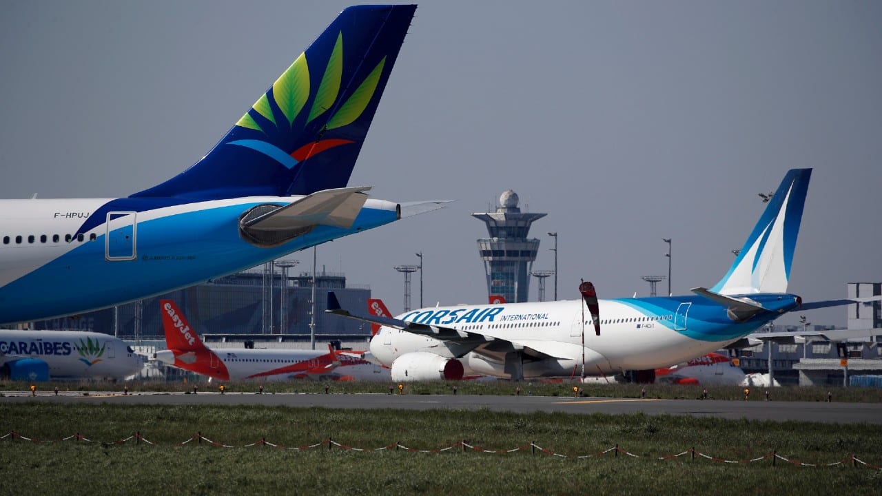 Airplanes are parked on the tarmac at the international airport of Orly, south of Paris, the day of its closure due to a drop in traffic as the government announced an extension of the initial 15-day home confinement period that came into force on March 17 in a bid to brake the spread of the Covid-19. (Image: AP)