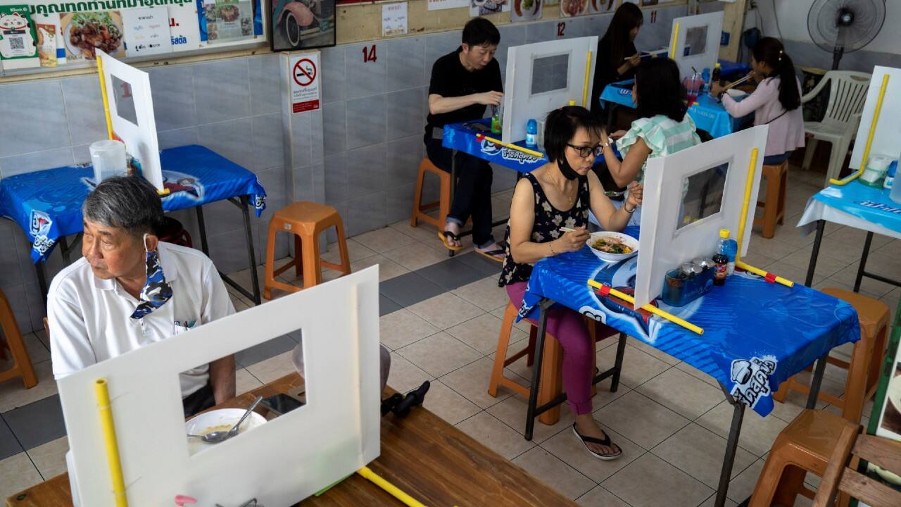 Guests have lunch in a noodle restaurant that reopened with social distancing measures in Bangkok, Thailand, on May 6. (Image: Reuters) Guests have lunch in a noodle restaurant that reopened with social distancing measures in Bangkok, Thailand, on May 6. (Image: Reuters)