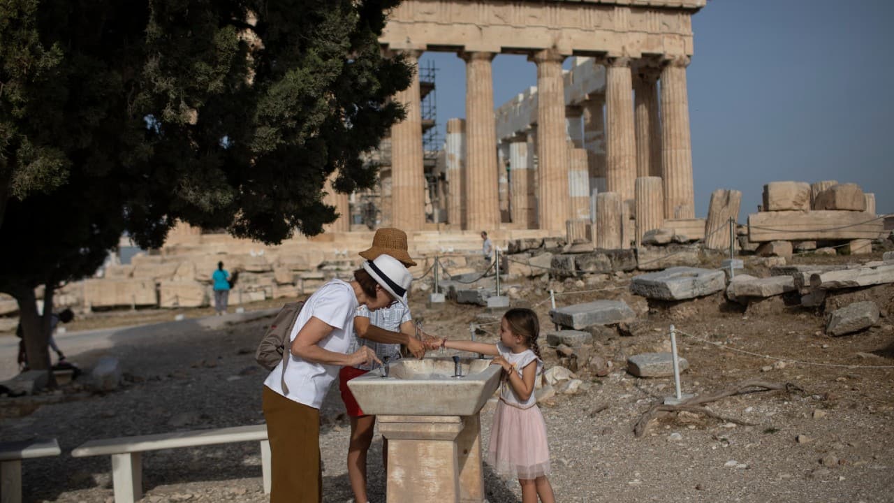 Visitors visits ancient Parthenon temple at the Acropolis hill of Athens on May 18. (Image: AP)