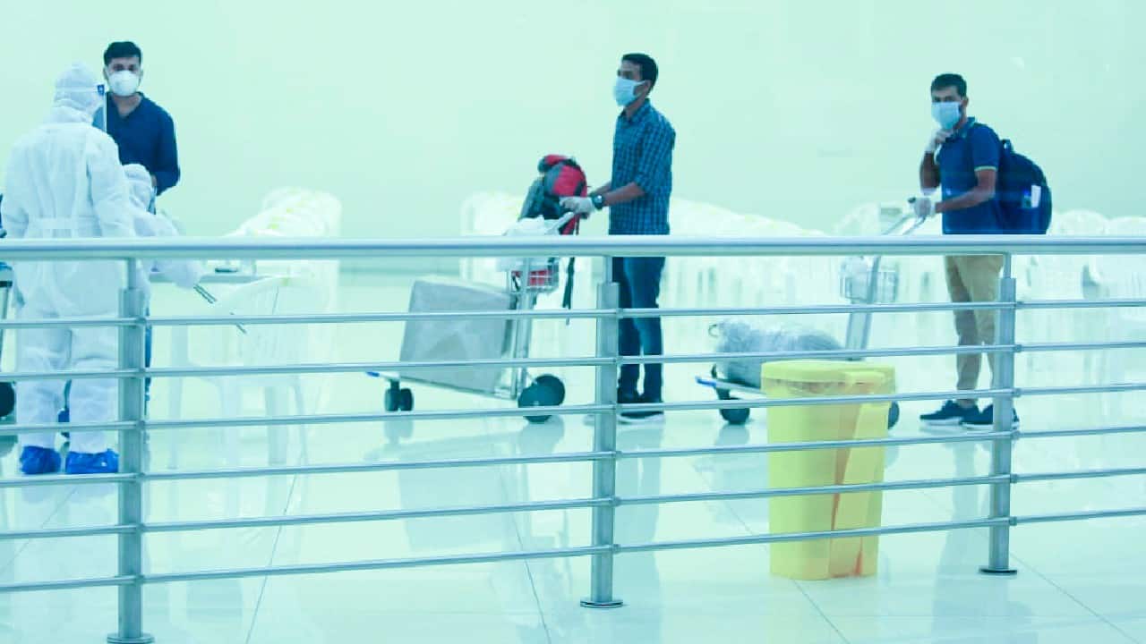 The first batch of Indian citizens from Abu Dhabi, arrive at the airport in Kochi, Kerala on May 7 (Government of Kerala via AP)