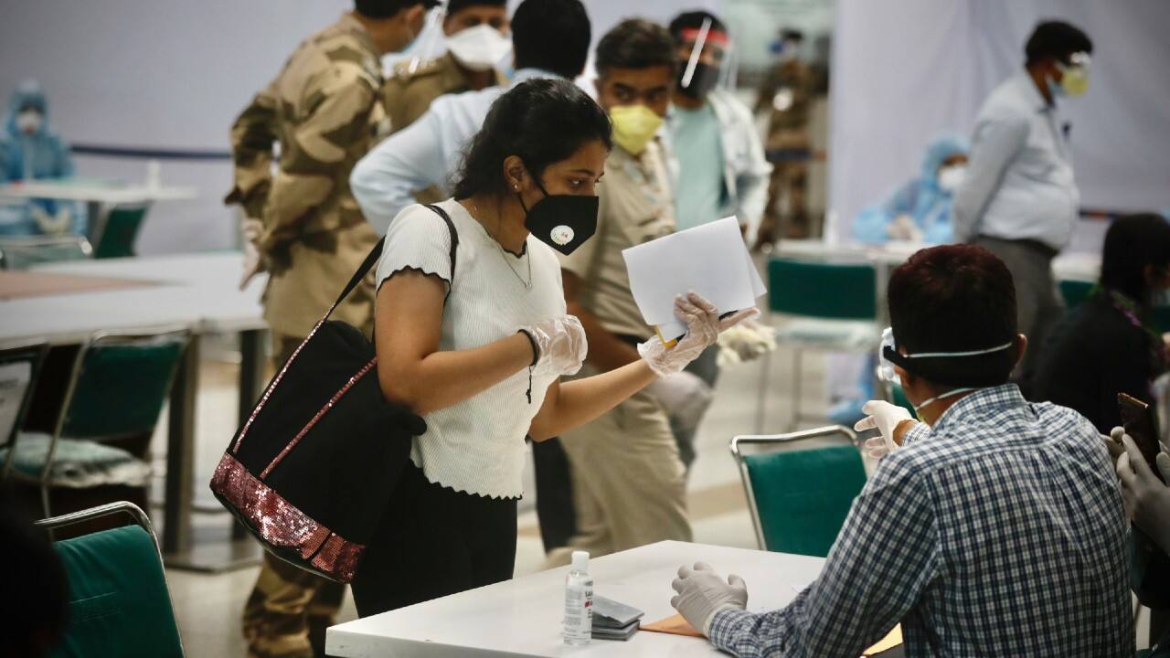 Air India started its largest repatriation operation from Delhi-Singapore flight on May 7, 2020. The first evacuation flight AI381 bring back Indian stuck in Singapore amid coronavirus lockdown at Delhi airport on May 8 morning. (Image: AP)