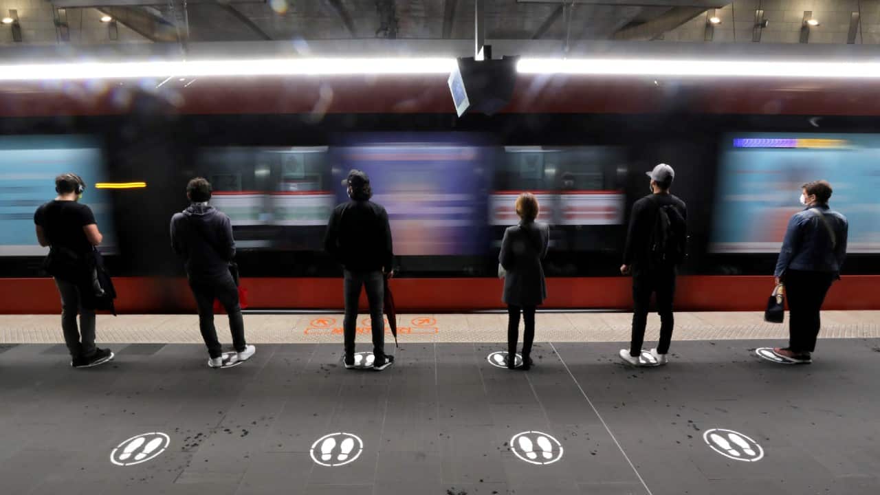 People stand on signs to respect social distancing on a platform for the tramway in Nice, France, on May 11. (Image: Reuters) People stand on signs to respect social distancing on a platform for the tramway in Nice, France, on May 11. (Image: Reuters)