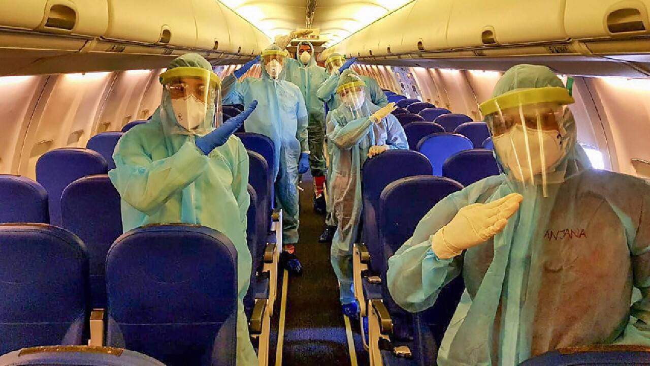 Air India Express crew members seen in protective suits as the flight took all the precautionary measures amid the novel coronavirus pandemic (Image: PTI)
