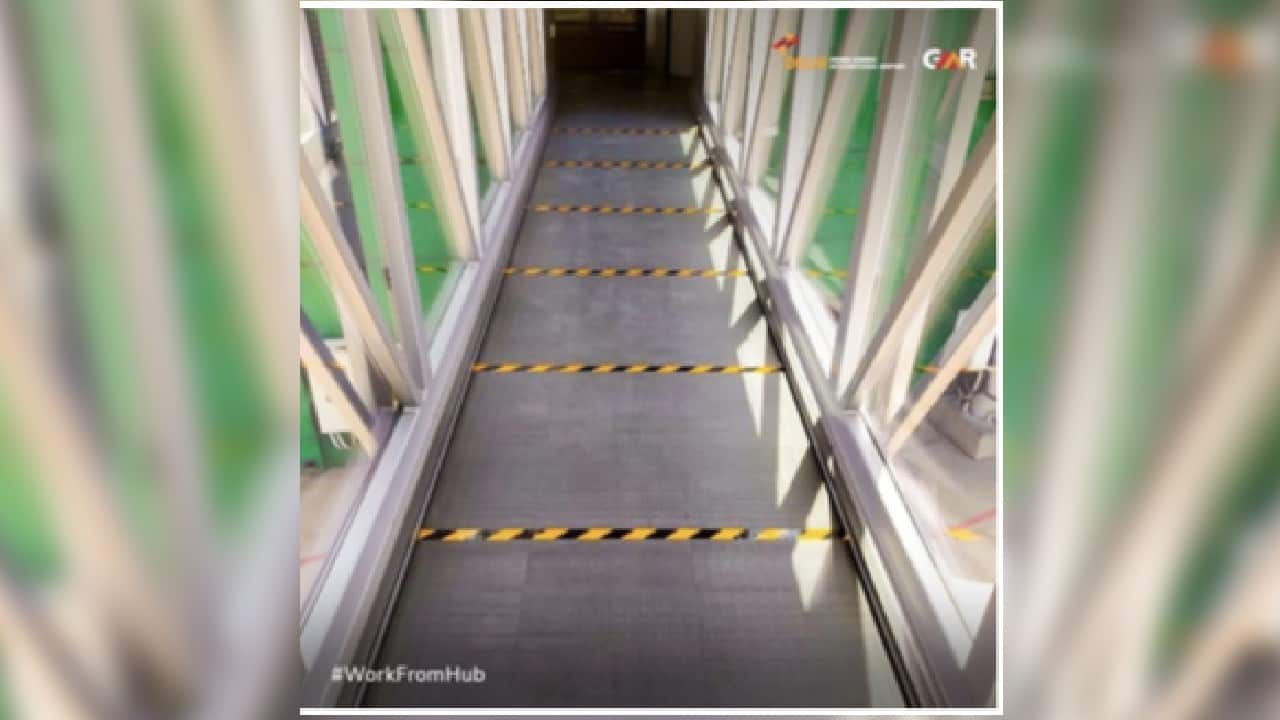 As you proceed to the boarding gates, be mindful of the social distancing marking at aerobridges and elevators. (Image: Delhi International Airport Limited)