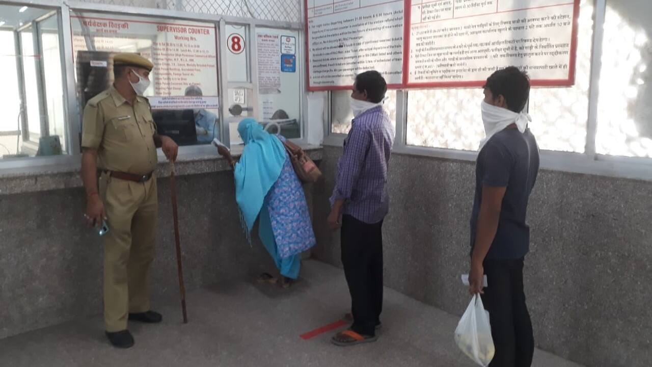 Passenger buys railway ticket from the counter after government eased lockdown restriction. (Image: News18)