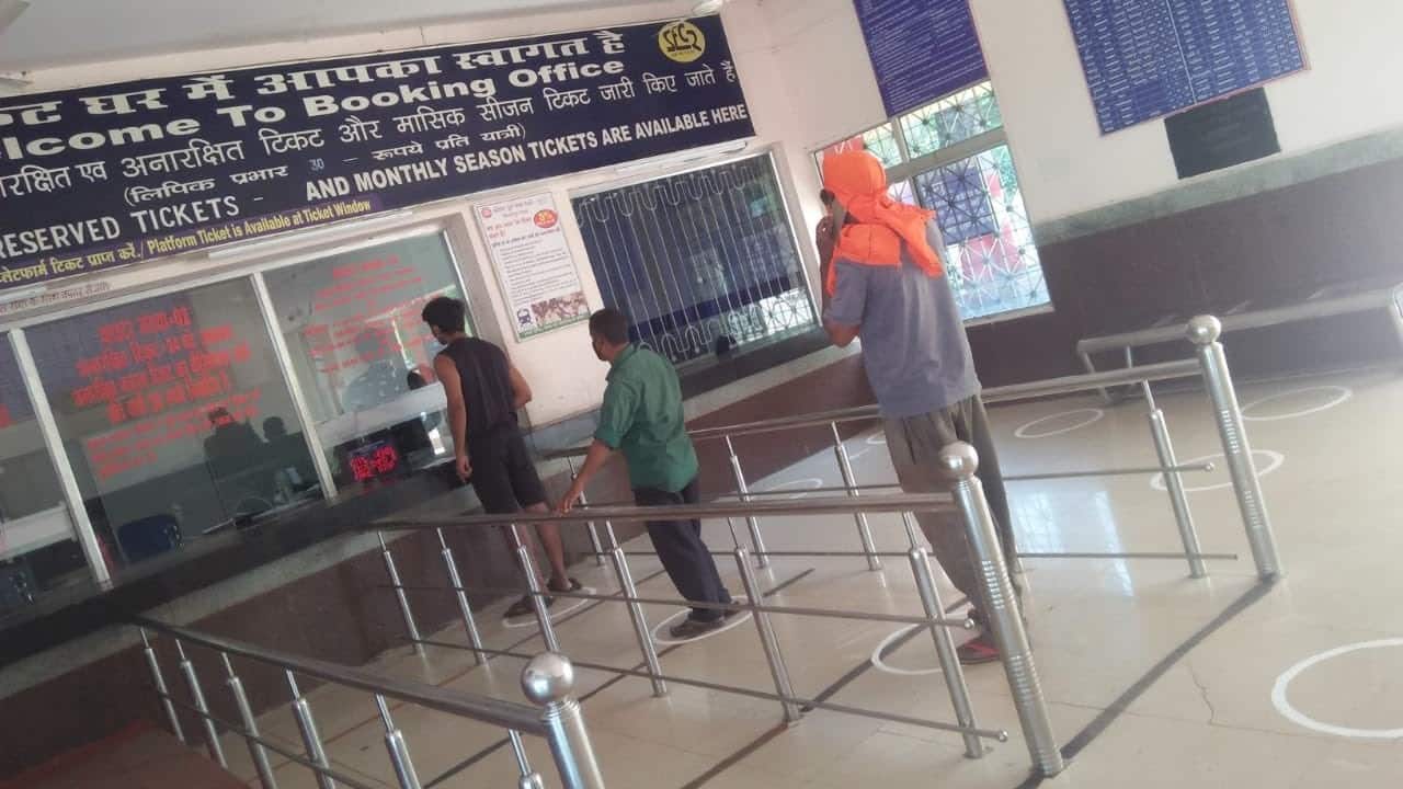 Passenger reservation booking counter resumes in select location from May 22. People are following preventive measure while standing in que. (Image: Twitter @RainMinIndia)