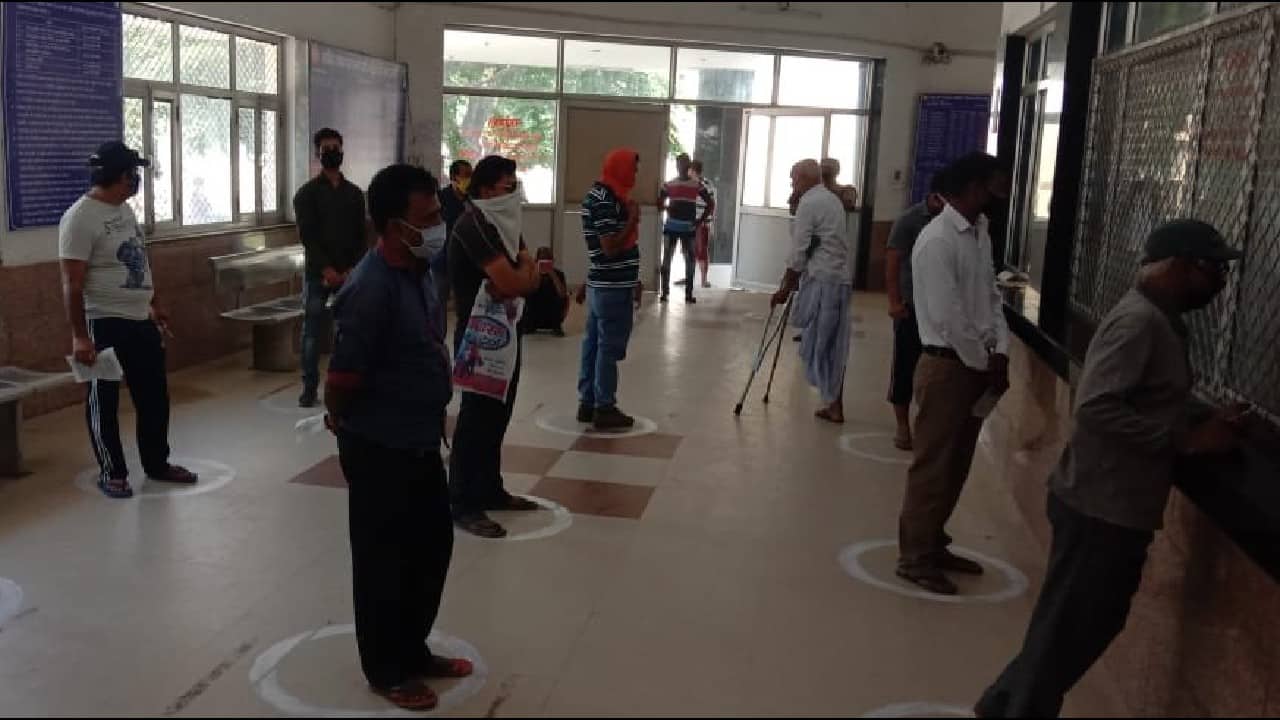 While everyone is waiting for their chance to buy rail tickets, the crowd is maintaining social distancing as a precautionary measure to combat coronavirus. (Image: Twitter @RailMinIndia)