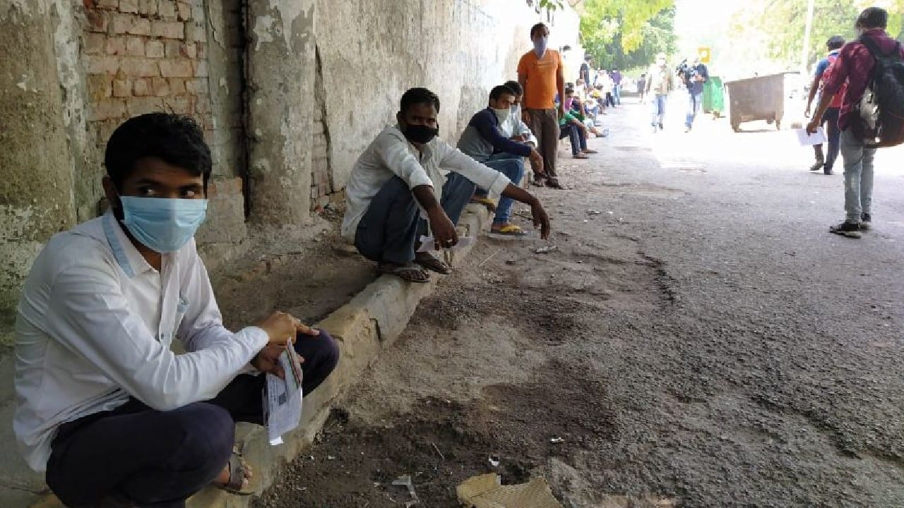 People gather outside the rail reservation centre as ticket booking counters open. (Image: News18)