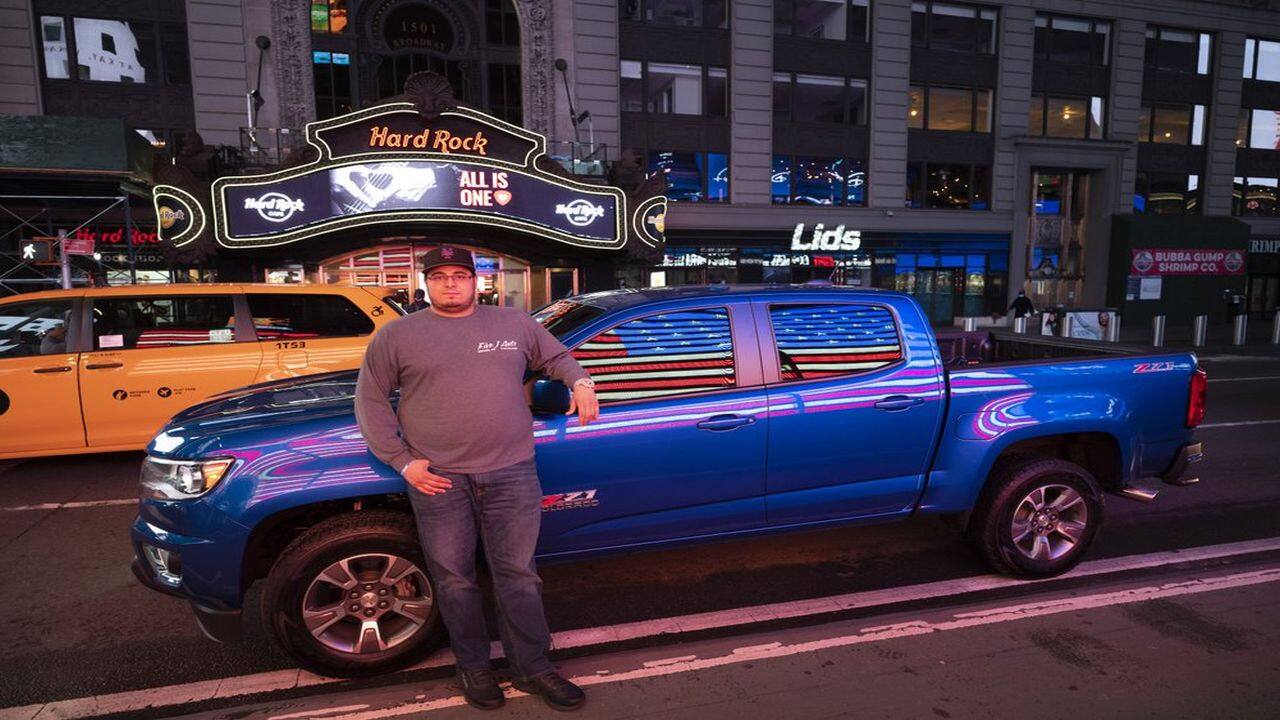Car collectors have been driving into the area for weeks in smaller packs. Mike Hodurski and Steve Cruz brought their Chevrolet pickup trucks Wednesday night and took photos in front of a light-up American flag at the corner of Broadway and 43rd Street.(AP)