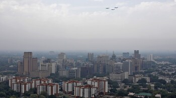 IAF aircraft fly past New Delhi’s skyline. (Image: Reuters)