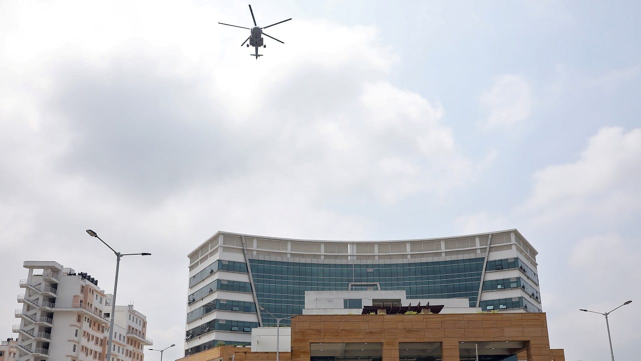 IAF’s M1-17 helicopter drops flower petals over a hospital in Kolkata, West Bengal. (Image: Reuters)
