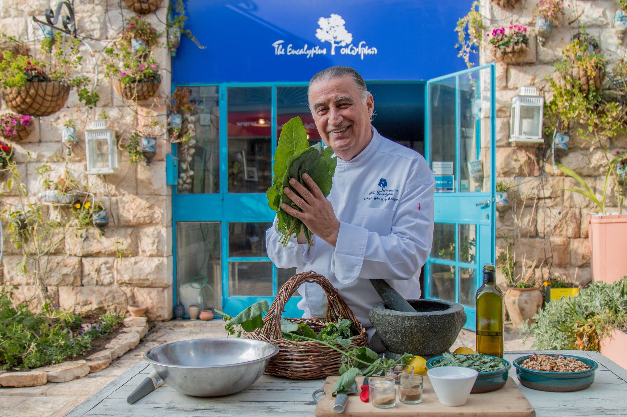 Chef Moshe Basson in front of The Eucalyptus, his restaurant in Jerusalem. (Photo credit: Ricki Rachman).