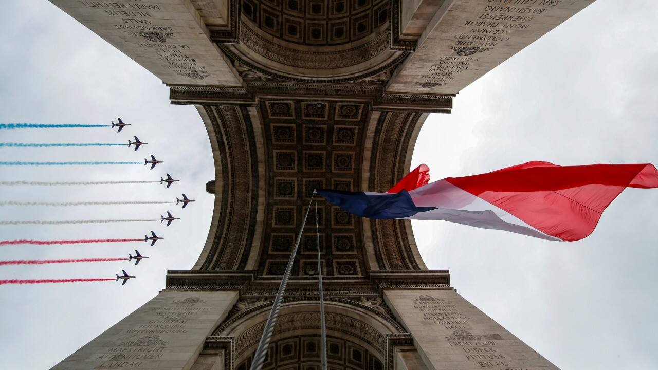 French elite acrobatic flying team &quot;Patrouille de France&quot; (PAF) performs a flying display of the French national flag over the Arc de Triomphe during the Bastille Day military parade honouring French health workers and their dedication in the fight against COVID-19 on Place de la Concorde in Paris. (Image: Reuters)