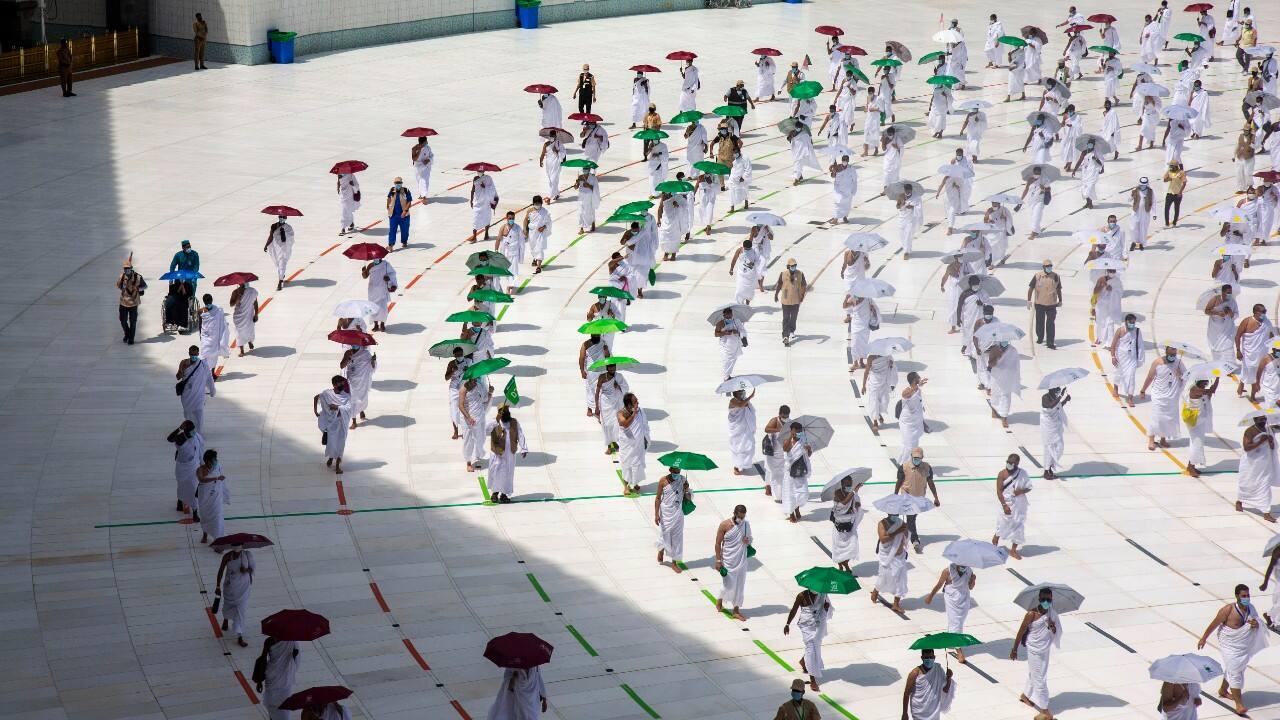 In this photo released by the Saudi Media Ministry, a limited numbers of pilgrims move several feet apart, circling the cube-shaped Kaaba in the first rituals of the hajj, as they keep social distancing to limit exposure and the potential transmission of the coronavirus, at the Grand Mosque in the Muslim holy city of Mecca, Saudi Arabia, July 29. (Image: Saudi Media Ministry via AP)