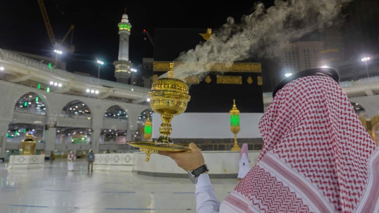 A man burns incense as the area around the Kaaba, the square structure in the Great Mosque, toward which believers turn when praying, is prepared for pilgrims, in Mecca, Saudi Arabia, July 26. (Saudi Ministry of Media via AP)