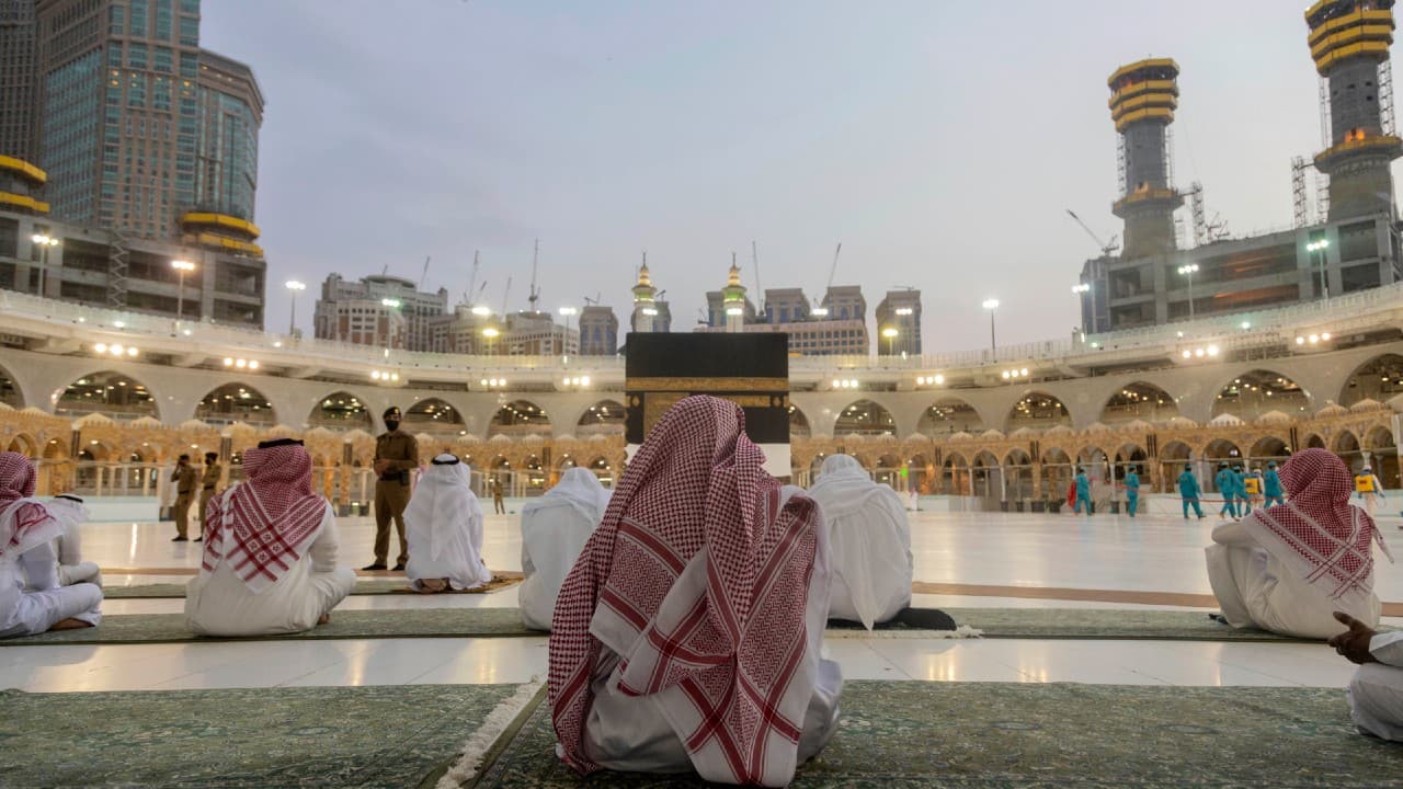 Pilgrims are also bringing their own prayer rugs and will be required to pray at a distance from one another, rather than packed shoulder-to-shoulder. Pilgrims pray around the Kaaba, the square structure in the Great Mosque, toward which believers turn when praying, in Mecca, Saudi Arabia, July 26. (Saudi Ministry of Media via AP)