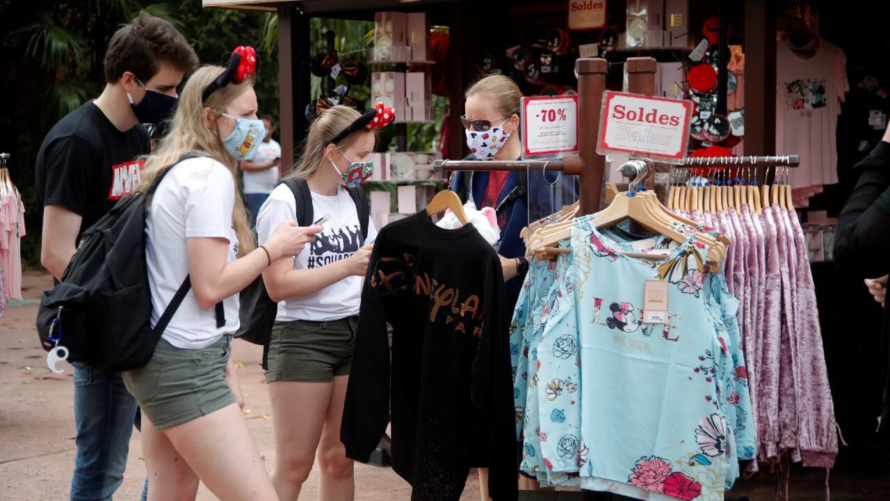Visitors buy souvenirs at Disneyland Paris as the theme park reopens its doors to the public in Marne-la-Vallee, near Paris, following the COVID-19 outbreak in France, July 15. (Image: Reuters)