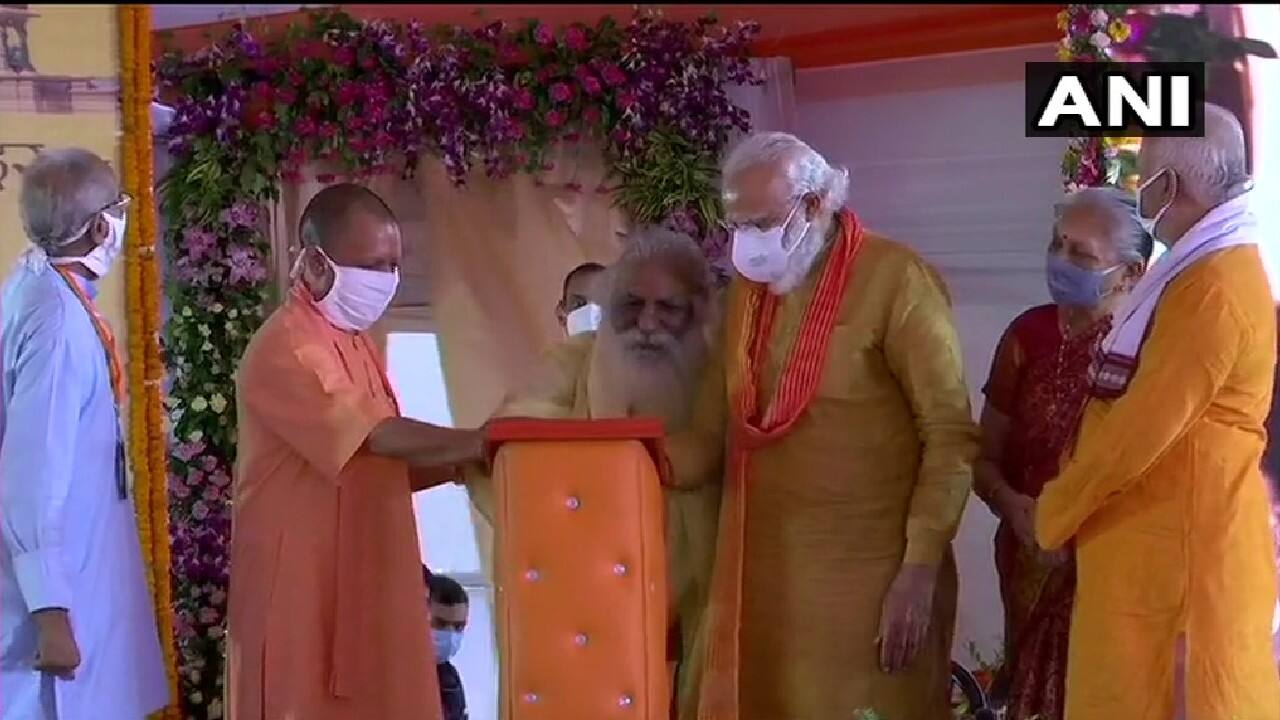 Prime Minister Narendra Modi along with others presented on the stage unveiled the plaque of Ram Mandir in Ayodhya. (Image: Twitter @ANI)
