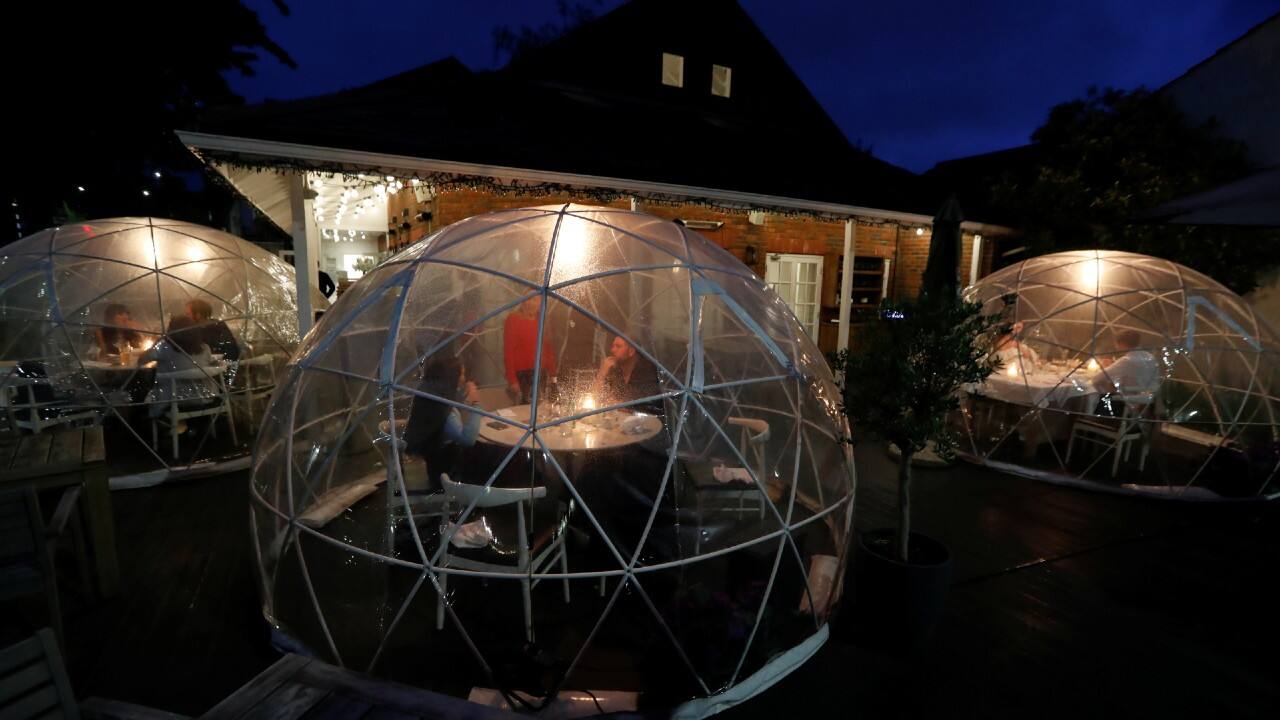 People drink and socialise in an outdoor area at St Villa bar and restaurant, following the outbreak of the coronavirus in St. Albans, Britain July 4. (Image: Reuters)