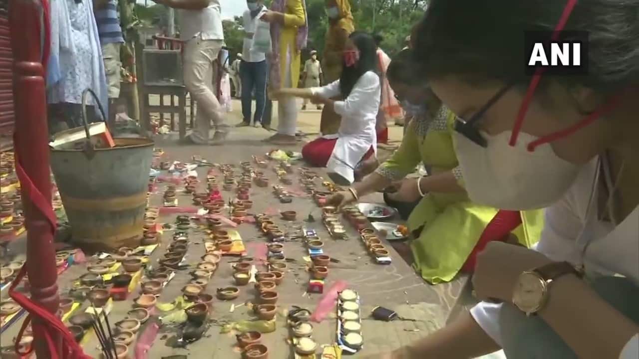 Devotees offer prayers outside a Lord Ganesh temple in Guwahati, on the occasion of Ganesh Chaturthi. A weekend lockdown has been imposed in the state to contain the spread of COVID-19 till August 31. (Image: Twitter @ANI)
