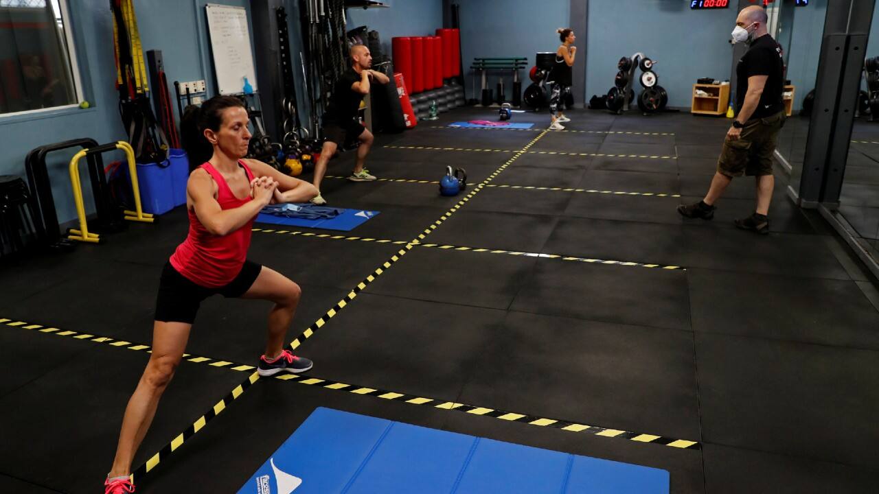 People exercise at a gym which has reopened with new social distancing and hygiene rules after months of closure due to ongoing outbreak in Rome, Italy, May 25. (Image: Reuters)