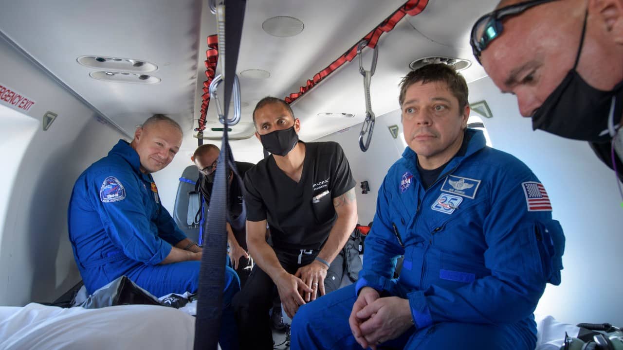 NASA astronauts Douglas Hurley, left, and Robert Behnken prepare to depart their helicopter at Naval Air Station Pensacola, August 2. (Bill Ingalls/NASA via AP) NASA astronauts Douglas Hurley, left, and Robert Behnken prepare to depart their helicopter at Naval Air Station Pensacola, August 2. (Bill Ingalls/NASA via AP)