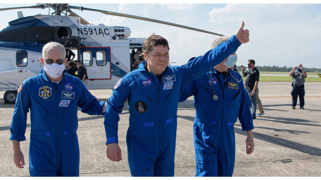 NASA astronaut Robert Behnken gives a thumbs up to onlookers as he boards a plane at Naval Air Station Pensacola to return him and NASA astronaut Douglas Hurley home to Houston, August 2. (Bill Ingalls/NASA via AP) NASA astronaut Robert Behnken gives a thumbs up to onlookers as he boards a plane at Naval Air Station Pensacola to return him and NASA astronaut Douglas Hurley home to Houston, August 2. (Bill Ingalls/NASA via AP)