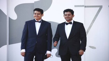 Director Chaitanya Tamhane, left, and actor Aditya Modak pose for photographers upon arrival at the premiere of the film 'The Disciple' during the 77th edition of the Venice Film Festival in Venice, Italy, Friday, Sept. 4, 2020. (Photo by Joel C Ryan/Invision/AP)