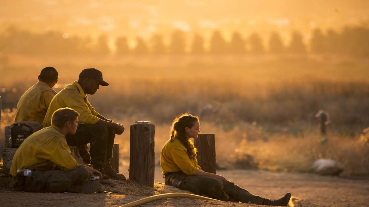 Firefighters battle exhaustion along with wildfire flames Firefighters battle exhaustion along with wildfire flames
