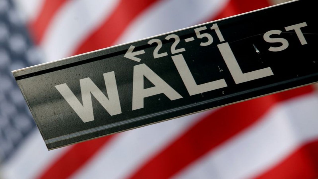 Wall Street climbs as crude oil prices slide, Federal Reserve in focus