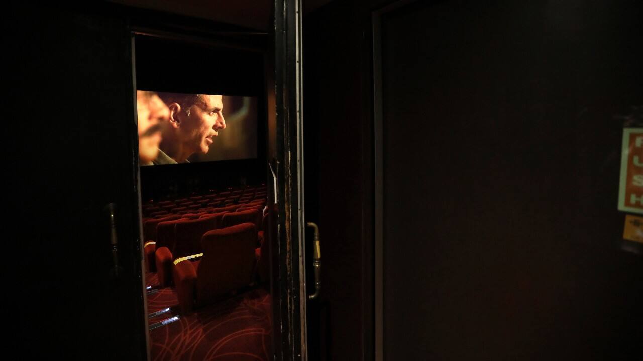 Despite the go-ahead from the central government to resume operations, not all theatres have reopened and even the much crowd is not flocking in yet. However, on the first-day of resuming operations, movie theatres struggled to lure the public back. Many ran shows for small audiences. (Image: AP)