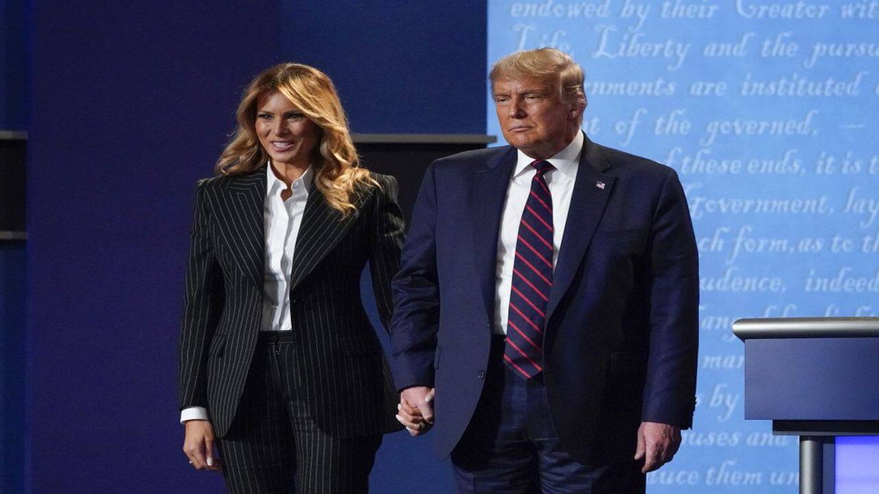 President Donald Trump and first lady Melania Trump hold hands on stage after the first presidential debate at Case Western University and Cleveland Clinic, in Cleveland, Ohio, September 29, 2020. (AP Photo)