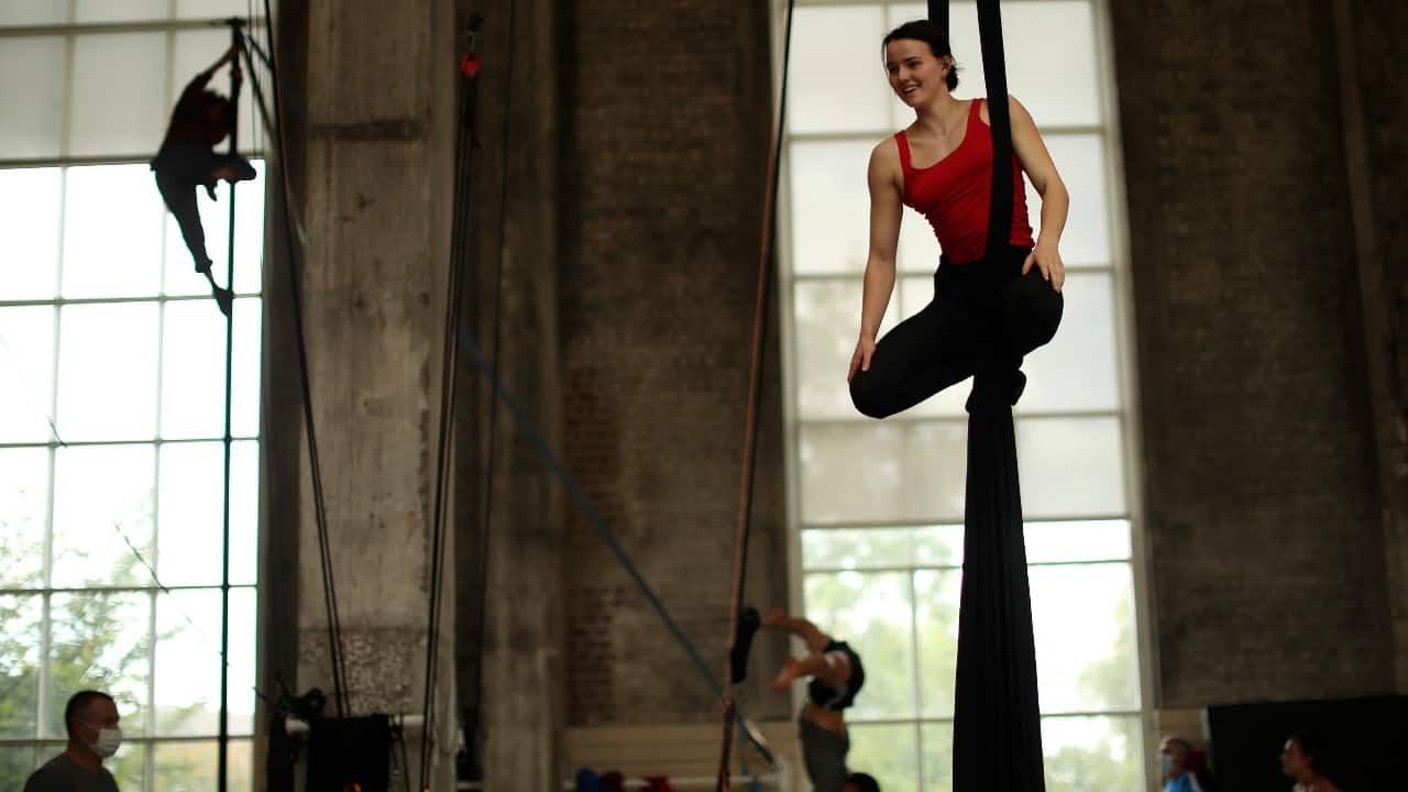 The ropes are swinging. Chalk stains the mats anew. And students at the ESAC international circus school in Brussels are smiling again, even if it is through a mask sometimes. Students work on their disciplines during a class at the Superior School of Circus Arts (ESAC) in Brussels, September 24. (Image: AP)