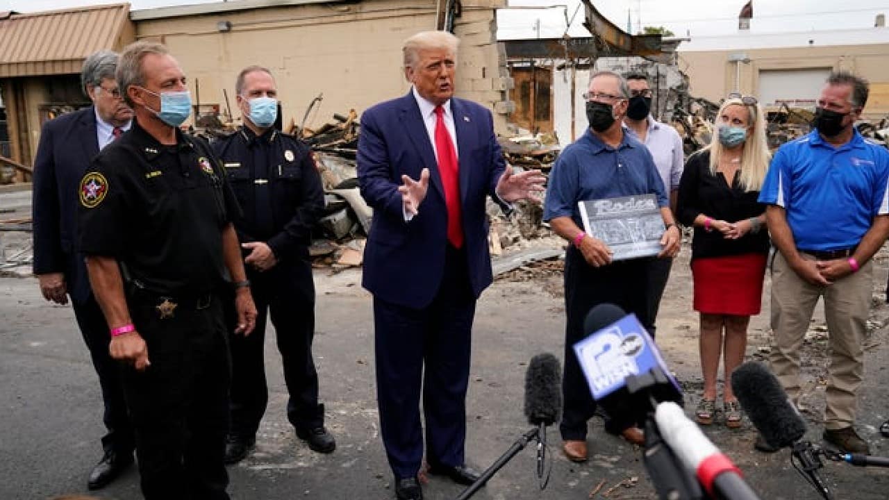 On September 1, US President Donald Trump was again defying the safety measures against the coronavirus outbreak. Trump again refused to wear mask on his visit to Kenosha to examine the damage caused to a business during the demonstrations. Almost everyone else except him were seen covering their faces. (Image: AP)