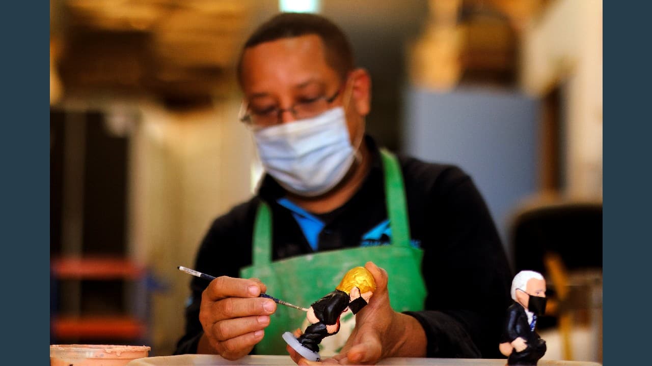A worker paints a U.S. President Donald Trump &quot;caganer&quot;, in a pottery in Torroella de Montgri, near Girona, Spain, October 20. (Image: Reuters)