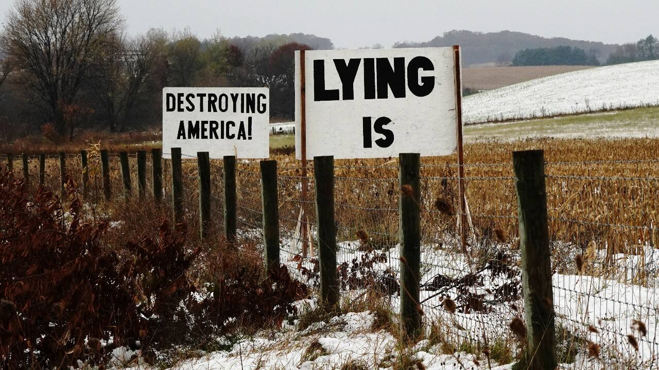 Signs are seen along Interstate 94 (I-94) in Otter Creek, Dunn County, Wisconsin, U.S., October 22. (Image: Reuters)