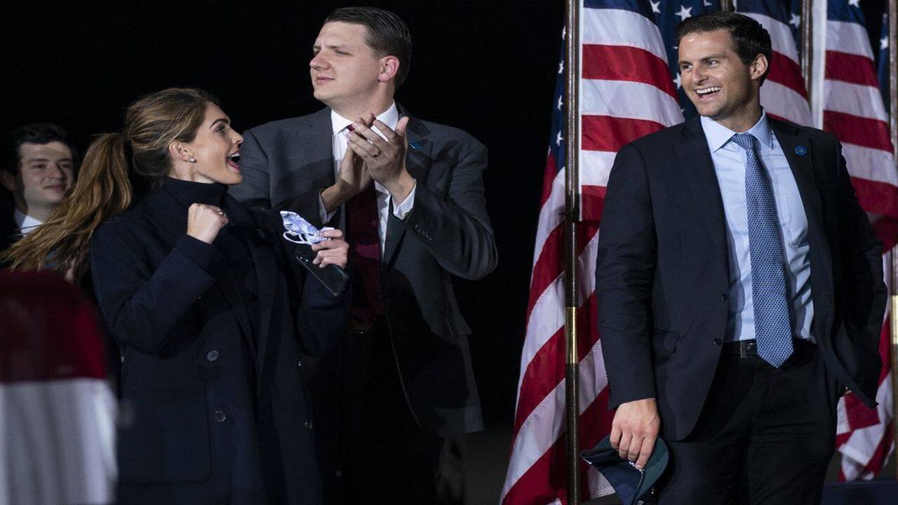 Counselor to the President Hope Hicks cheers as President Donald Trump speaks during a campaign rally at Harrisburg International Airport, Saturday, September 26, 2020, in Middletown, Pa. Special assistant to the President and White House trip director William Russell, center, and director of the White House personnel office John McEntee, watch. (AP Photo)