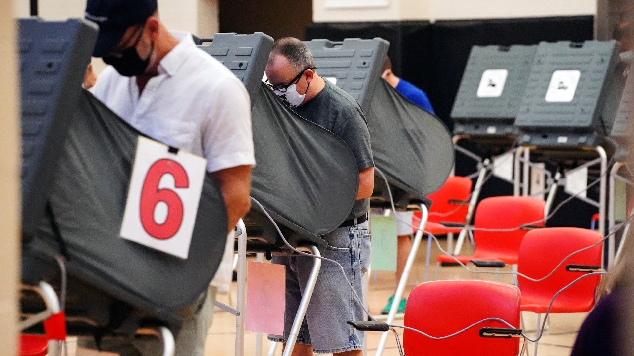 People cast their ballots for the upcoming presidential election as early voting begins in Houston, Texas. (Image: Reuters)