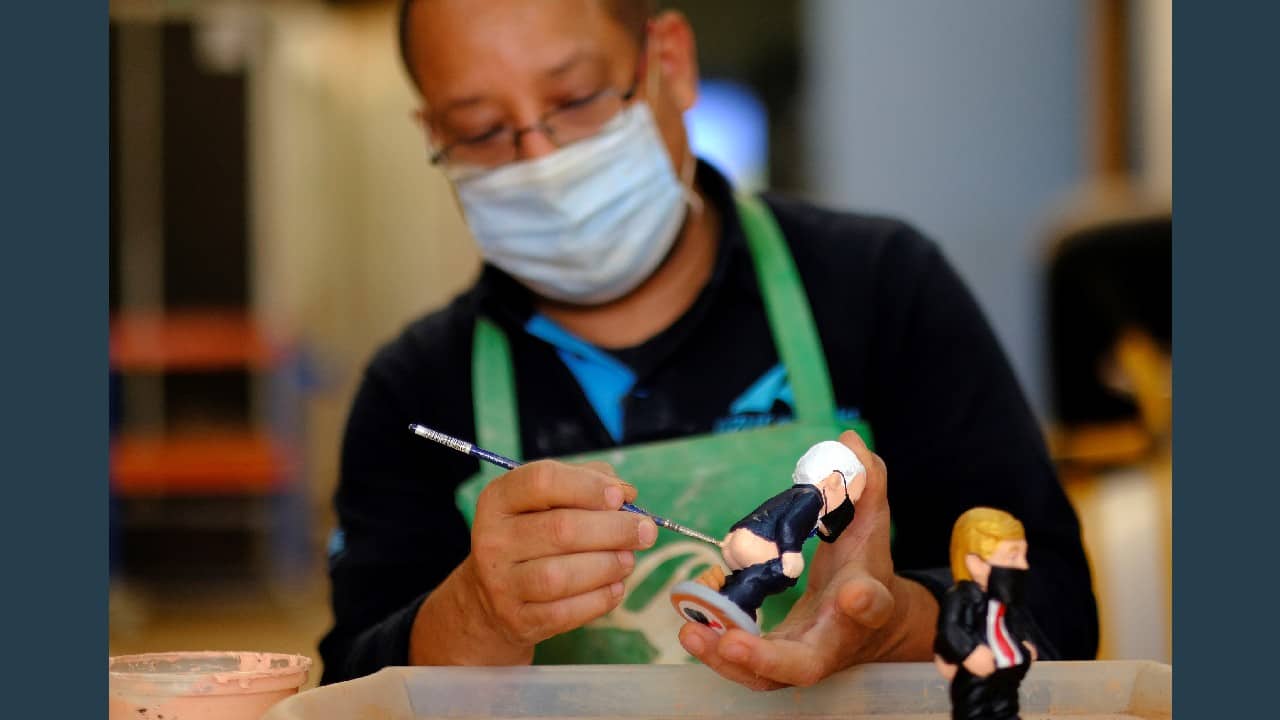 Caught with their pants down and wearing face masks, U.S. presidential candidates Donald Trump and Joe Biden take the limelight in the 2020 collection of Catalan Christmas statuettes known as &quot;caganers,&quot; or &quot;poopers,&quot; as elections in the Unites States are set to take place on November 3. &quot;Caganers&quot; are a longstanding holiday tradition in the north eastern Spanish region where the statuettes are hidden in nativity scenes, to be spotted by family and friends. (Image: Reuters)