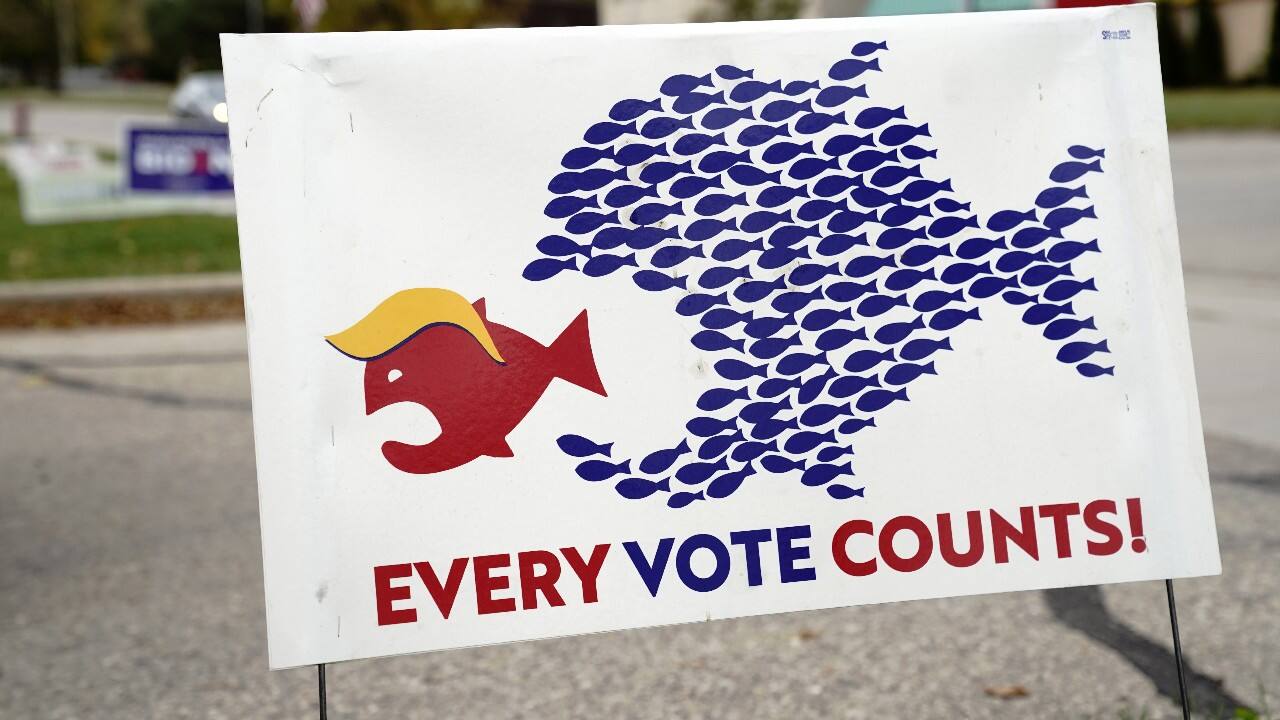 A sign encouraging voter turnout is seen at a campaign yard sign distribution site for U.S. Democratic presidential candidate Joe Biden and his running mate, Senator Kamala Harris, in Madison, Wisconsin, U.S., October 17. (Image: Reuters)