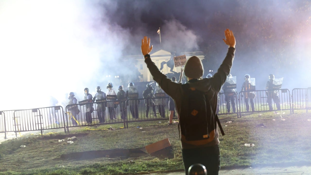 6 | Protesters gassed outside White House, June 1, 2020: Washington was one of several cities convulsed by largely peaceful protests in the wake of the death on May 25 of George Floyd, a Black man, at the hands of Minneapolis police. On June 1, Trump gave an address at the White House invoking the “law and order” theme he would employ during the rest of his campaign. U.S. Park Police and National Guard troops, clad in riot gear, then used pepper spray to clear the park outside the White House of protesters so that Trump could walk to historic St. John’s Church and pose for a photo holding up a Bible. The melee became an image that would haunt Trump, as polls showed Americans largely supportive of the protests for racial justice. His approval rating soon dropped to a seven-month low. (Image: Reuters) 6 | Protesters gassed outside White House, June 1, 2020: Washington was one of several cities convulsed by largely peaceful protests in the wake of the death on May 25 of George Floyd, a Black man, at the hands of Minneapolis police. On June 1, Trump gave an address at the White House invoking the “law and order” theme he would employ during the rest of his campaign. U.S. Park Police and National Guard troops, clad in riot gear, then used pepper spray to clear the park outside the White House of protesters so that Trump could walk to historic St. John’s Church and pose for a photo holding up a Bible. The melee became an image that would haunt Trump, as polls showed Americans largely supportive of the protests for racial justice. His approval rating soon dropped to a seven-month low. (Image: Reuters)