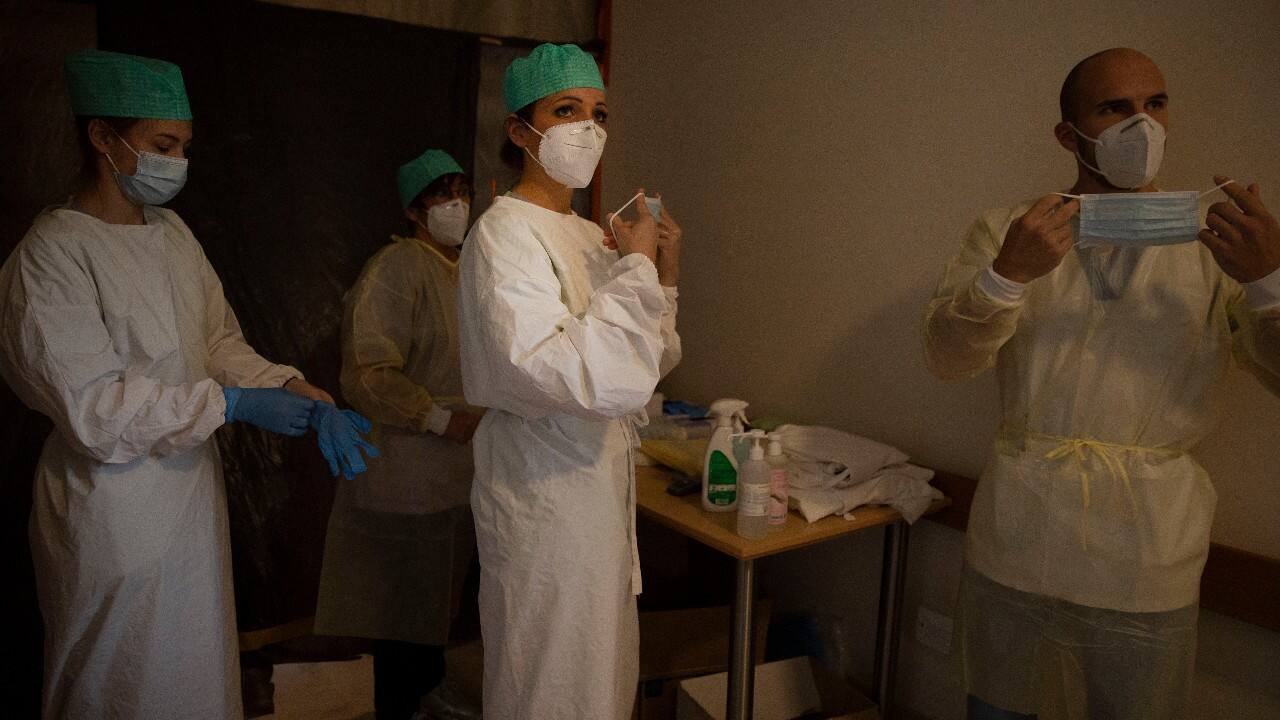 Belgian Army healthcare workers and supervisory personnel suit up prior to doing their rounds in the COVID-19 ward of the CHC nursing home in Landenne, Belgium, November 4. Belgium, proportionally still the worst-hit nation in Europe when it comes to coronavirus cases. The Belgian Army has been deployed to help several hard hit areas in the country. (Image: AP)