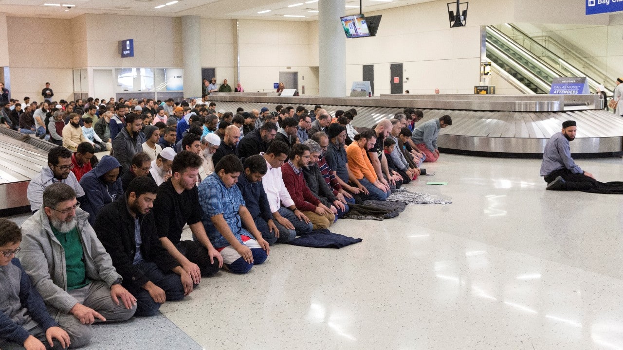 People gather to pray in baggage claim during a protest against the travel ban imposed by U.S. President Donald Trump's executive order, at Dallas/Fort Worth International Airport in Dallas, Texas, U.S. January 29, 2017. (Image: Reuters) People gather to pray in baggage claim during a protest against the travel ban imposed by U.S. President Donald Trump's executive order, at Dallas/Fort Worth International Airport in Dallas, Texas, U.S. January 29, 2017. (Image: Reuters)